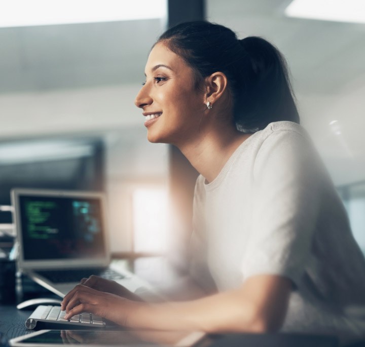 image of a woman sitting at a desk