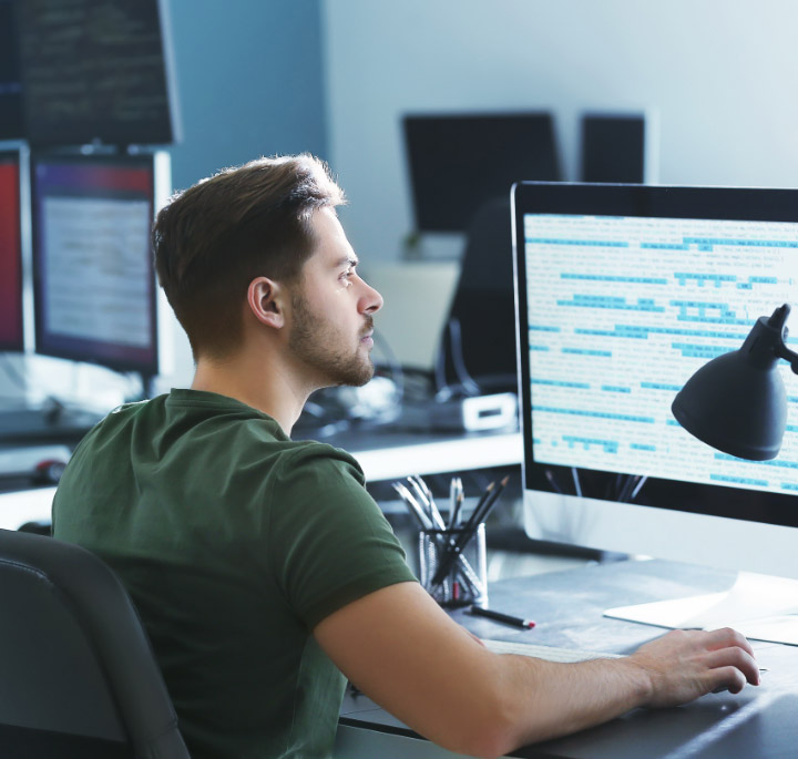 image of a man working at a computer